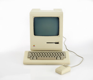 original Macintosh 128k called Apple Macintosh on white background. This was the first produced Mac, released on january 1984